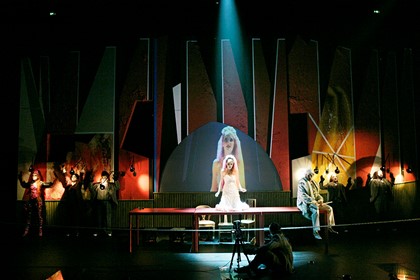 Production still for "The Threepenny Opera". Anna O'Byrne (centre) as Polly Peachum. Photographer: Jeff Busby