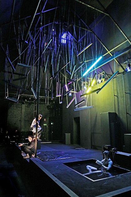 Production still for "A View of Concrete". L-R: Richard Pyros, Lauren Urquhart, Peter Houghton. Photographer: Jeff Busby