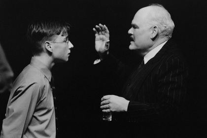 Production still for "A Happy and Holy Occasion". L-R: James McKenna as Christy O'Mahon, Malcolm Robertson as Vincent de Paul (Houses) O'Halloran. Photographer: Jeff Busby