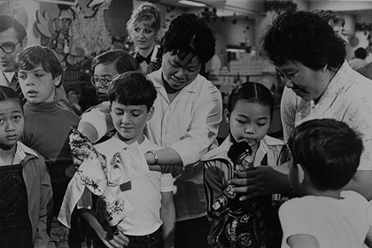 Production still for "the Fukien Puppet Theatre of China". Troupe members show their puppets to Melbourne children. Photographer: Jeff Busby