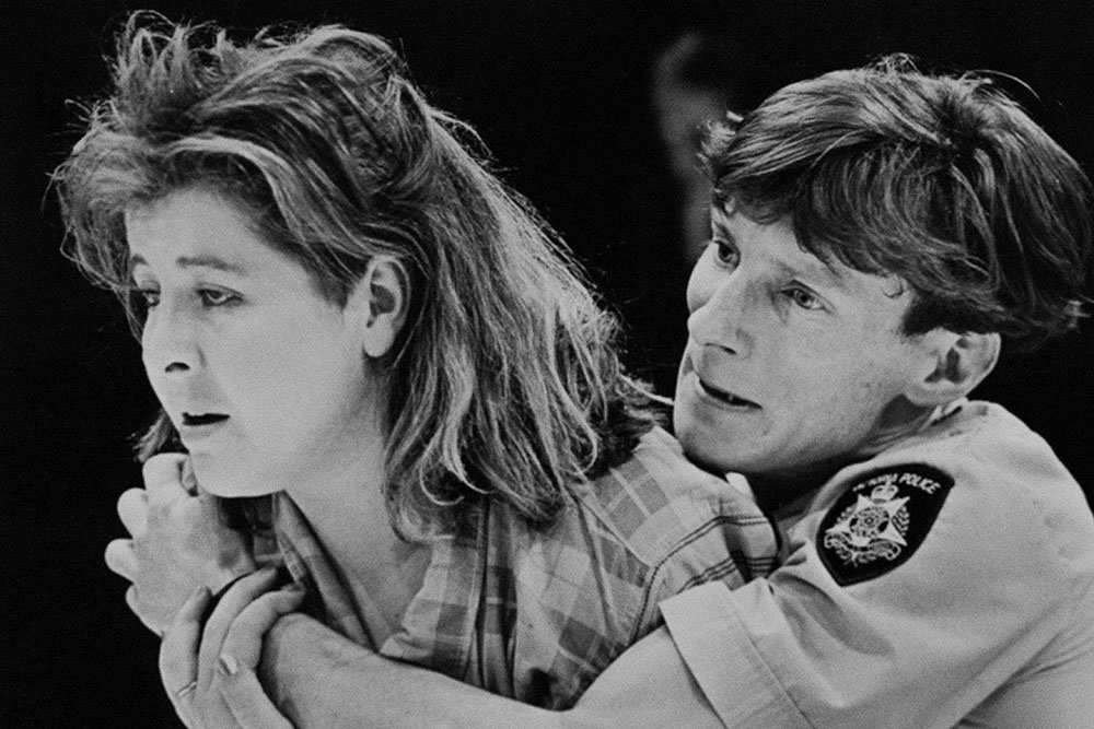 Production still for "A Bed of Ruses". L-R: Carole Patullo, Daryl Pellizzer. Photographer: David B. Simmonds.