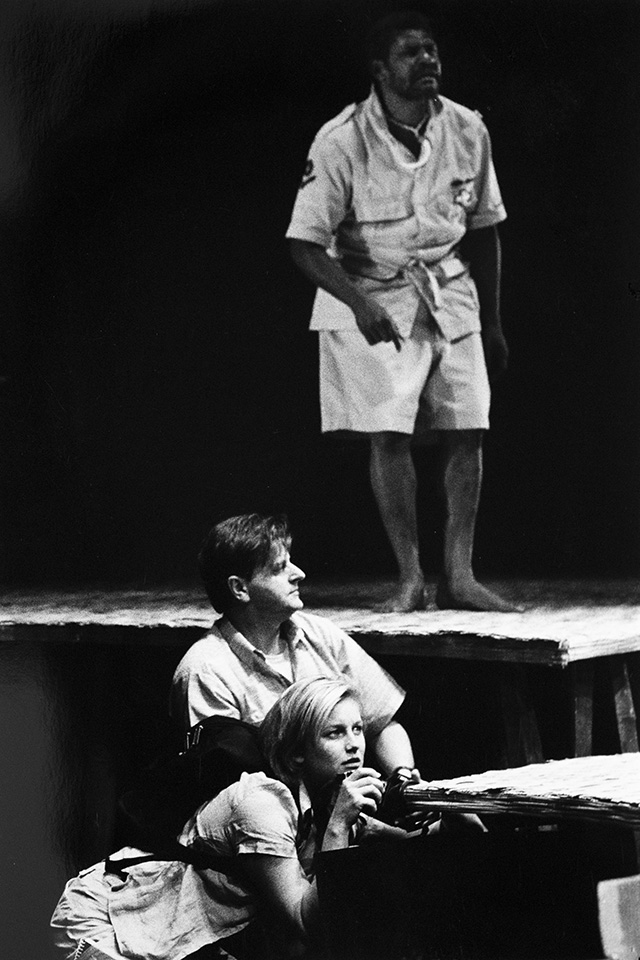 Production still for "Rising Fish Prayer". L-R: Sophie Heathcote as Petra Dankou, Robert Grubb as Ken Peterson, Kilori Susuve as Ubuku. Photographer: Jeff Busby