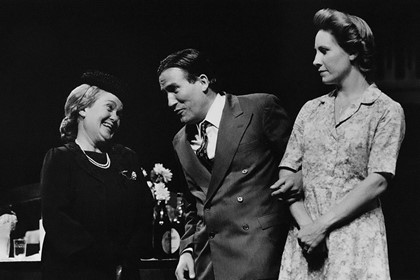 Production still for "A Happy and Holy Occasion". L-R: Beverley Dunn as Cecilia McManus, Richard Piper as Denny O'Mahon, Ailsa Piper as Mary O'Mahon. Photographer: Jeff Busby