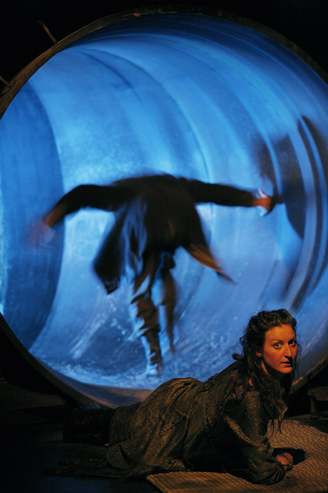 Production still for "Knives in Hens". L-R: Robert Menzies as Pony William, Kate Box as the Young Woman. Photographer: Jeff Busby