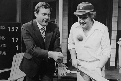 Production still for "Outside Edge". John Wood is taught the finer points by sporting legend Ron Barassi. Photographer: Jeff Busby