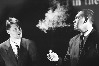 Production still for "Tear From a Glass Eye". L-R: Peter Houghton as Titus, Alex Menglet as Mr Petra. Photographer: Jeff Busby