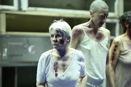 Production still for "The Women of Troy". L-R: Robyn Nevin as Hecuba, Jennifer Vuletic as a Woman of Troy. Photographer: Tracey Schramm