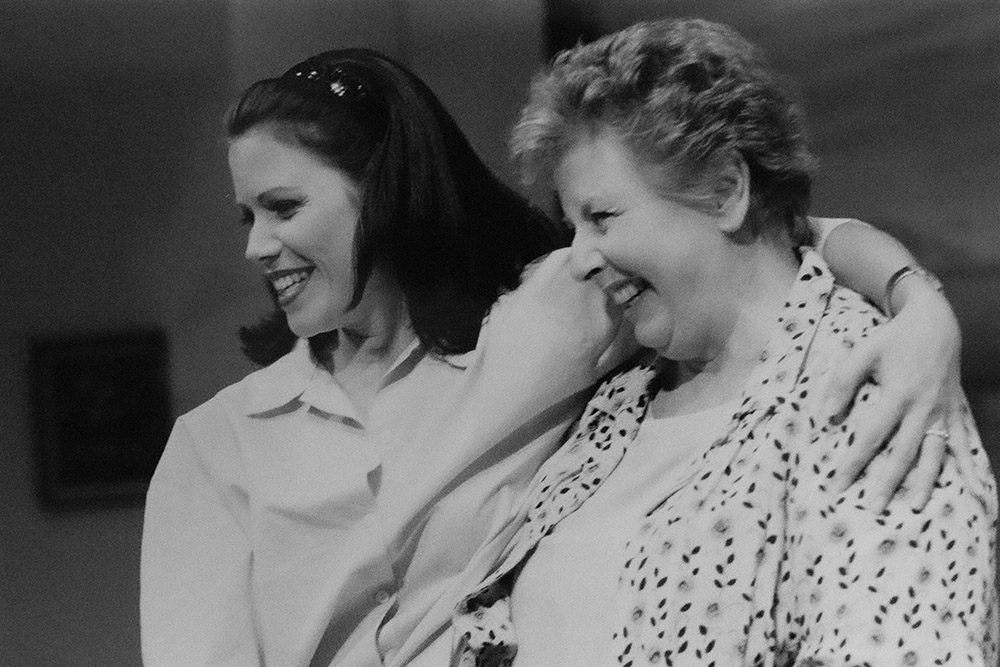 Production still for "Secret Bridesmaids' Business". L-R: Jane Hall as Meg Bacon, Joan Sydney as Colleen Bacon. Photographer: Jeff Busby