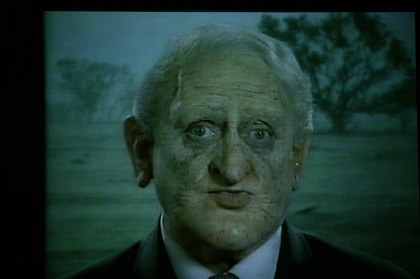 Production still for "The Big Con". Max Gillies as Philip Ruddock. Photographer: Lisa Tomasetti