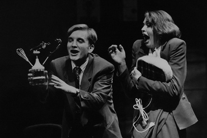 Production still for "The Adman". L-R: Ben Grant as Rhys Burns, Nadja Kostich as Leah Blonskey. Photographer: Jeff Busby